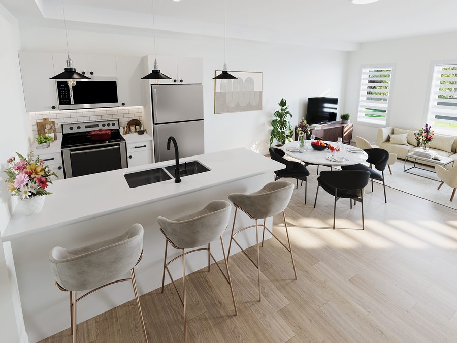 Rental townhome kitchen at 1811 John Brebeuf with a quartz island seating three, open to the dining and living area