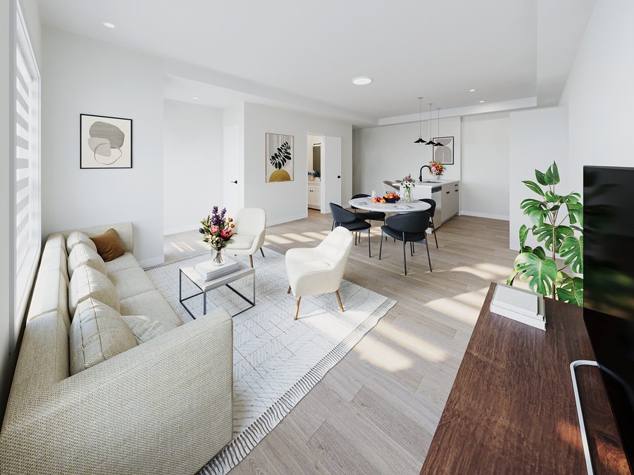 Open-concept main floor of a 1811 John Brebeuf townhome, looking from the living room through the dining area to the kitchen
